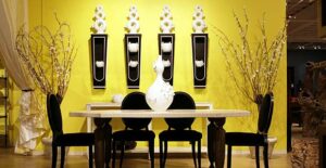 Photo of classy yellow dining room leading an interior design trend with colors that pop