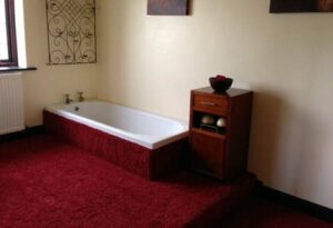 Photo of a bathroom with carpet. Bad Home Design Mistakes