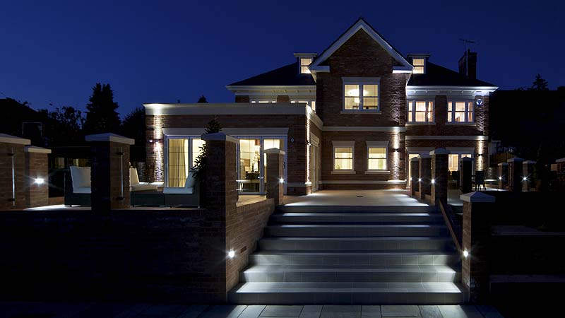 Photo of a home with amazing landscape lighting