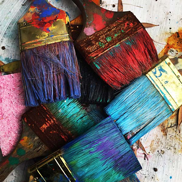 Photo of different colored paint brushes