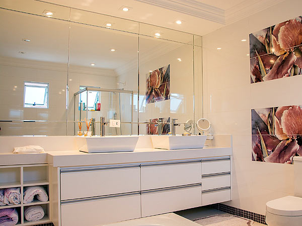 Photo of a contemporary bathroom with wall mounted mirrors