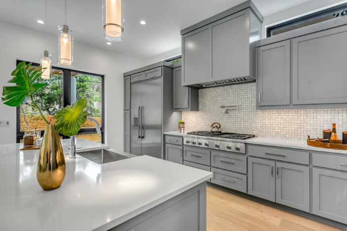 Kitchen Countertops 101: Photo of an awesome grey kitchen with quartz countertops