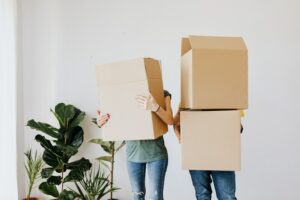 Photo of people with moving boxes